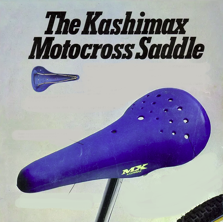 A blue saddle on a bicycle. The Kashimax Motocross Saddle.